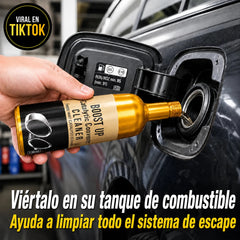 Tokbolt catalytic converter cleaner bottle being poured into a vehicle fuel tank