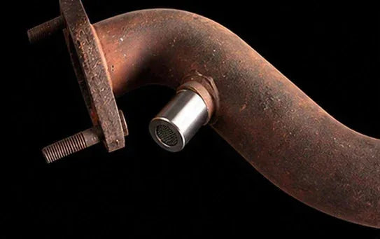 Oxygen sensor spacer installation step placing the adapter on the exhaust pipe